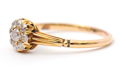 Lot 39 - A diamond ring, the small round cluster set...