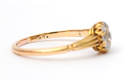 Lot 39 - A diamond ring, the small round cluster set...