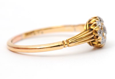 Lot 39 - A diamond ring, the small round cluster set...