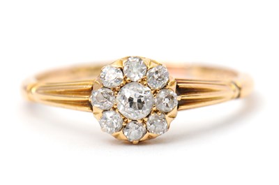 Lot 39 - A diamond ring, the small round cluster set...