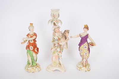 Lot 155 - Continental porcelain candlestick of gentleman...