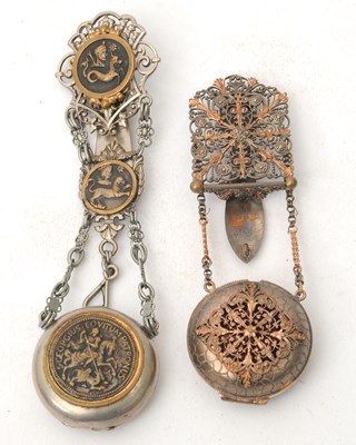 Lot 150 - Two continental metal chatelaine watch holders,...