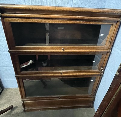 Lot 374 - A Globe Wernick three tier oak stacking...