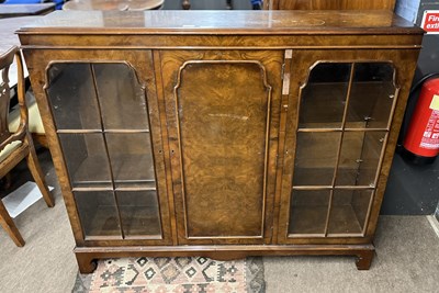 Lot 389 - A 20th Century walnut veneered bookcase...