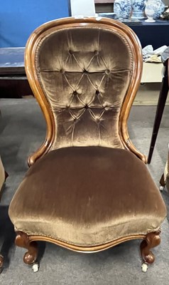 Lot 439 - A Victorian nursing chair with brown buttoned...