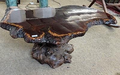 Lot 460 - An unusual coffee table formed from a live...