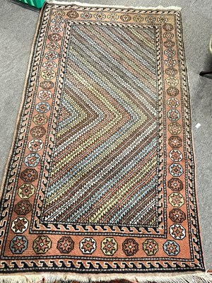 Lot 464 - A 20th Century Turkish wool rug decorated with...
