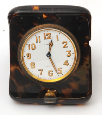 Lot 168 - A faux tortoiseshell eight day travel clock...