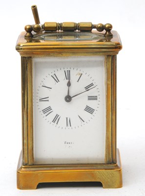 Lot 224 - A Vocan brass carriage clock, the clock has a...