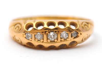 Lot 15 - A five stone diamond ring, set with five small...
