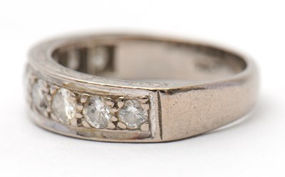 Lot 16 - A half eternity diamond ring, set with round...