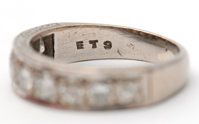 Lot 16 - A half eternity diamond ring, set with round...
