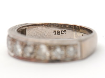 Lot 16 - A half eternity diamond ring, set with round...