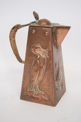 Lot 185 - Newlyn School copper jug with wicker handle
