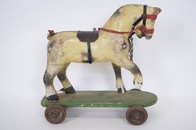 Lot 189 - Small wooden toy of a horse, on a rectangular...