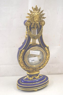 Lot 105 - A reproduction porcelain cased mantel clock