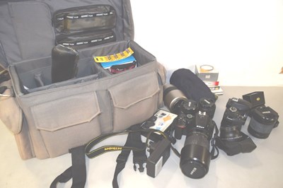 Lot 176 - Two Nikon cameras together with various lenses,...