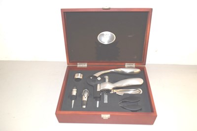 Lot 181 - A boxed wine corking set