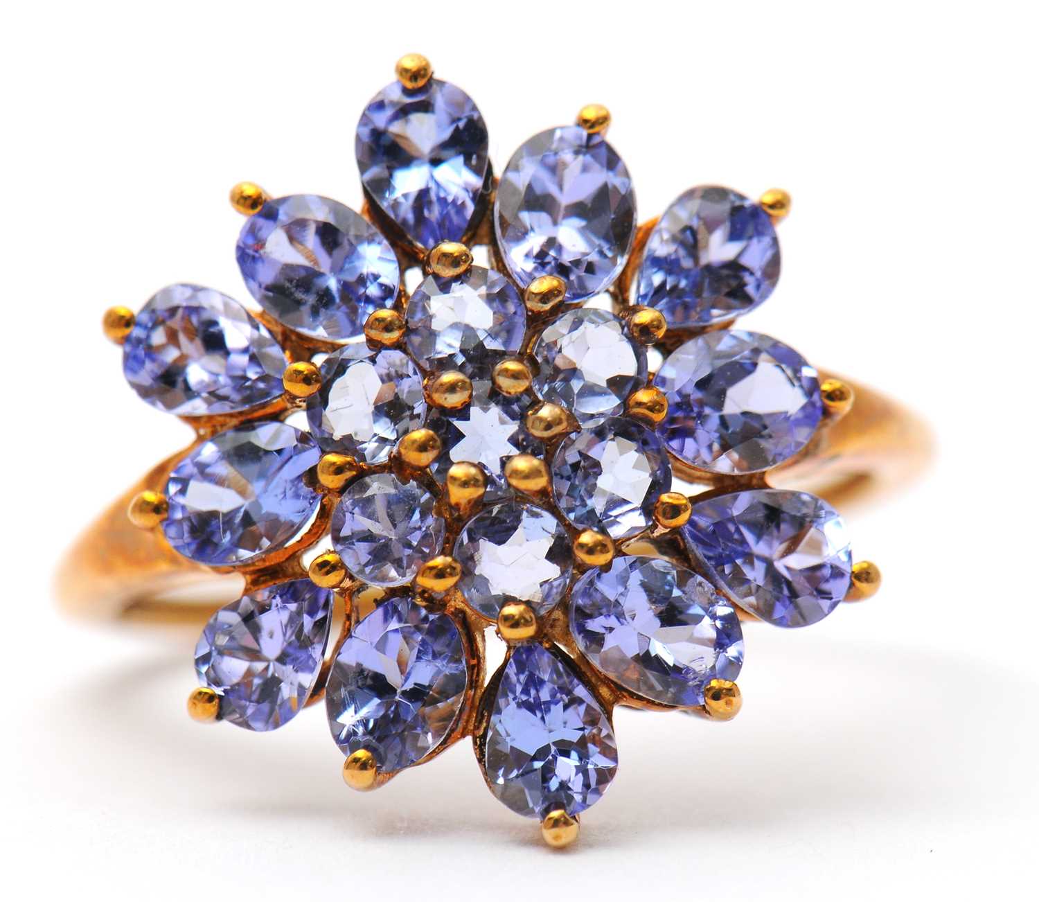 Lot 17 - A 9ct tanzanite cluster ring, the cluster...