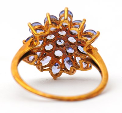 Lot 17 - A 9ct tanzanite cluster ring, the cluster...