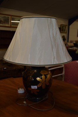 Lot 396 - A modern table lamp with floral decoration