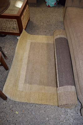 Lot 416 - A modern beige floor rug