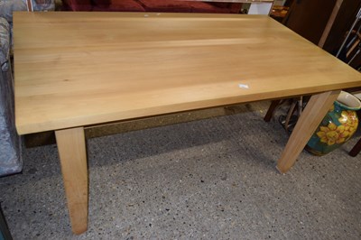 Lot 409 - A light wood dining table
