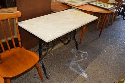 Lot 437 - A marble topped and iron based garden table