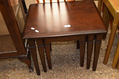 Lot 449 - A nest of three dark wood tables