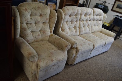 Lot 464 - A floral three seater sofa and matching armchair
