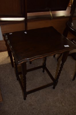 Lot 473 - A small oak lamp table on barley twist legs