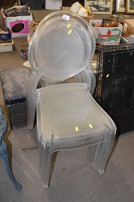 Lot 830 - Four perspex ghost style dining chairs