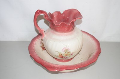Lot 503 - A floral decorated wash bowl and jug