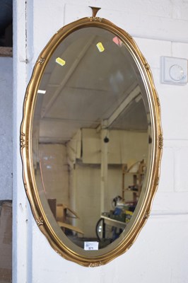 Lot 571 - Oval wall mirror in gilt fininsh frame