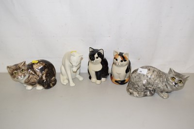 Lot 65 - Two Winstanley cats and three other model cats