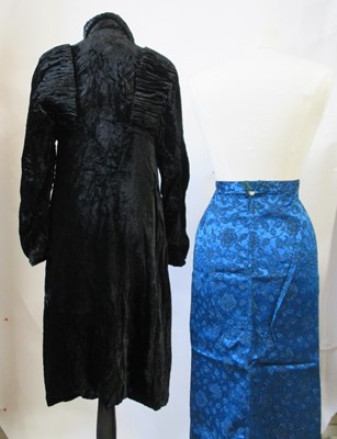 Lot 14 - An early 20th century black velvet coat with...