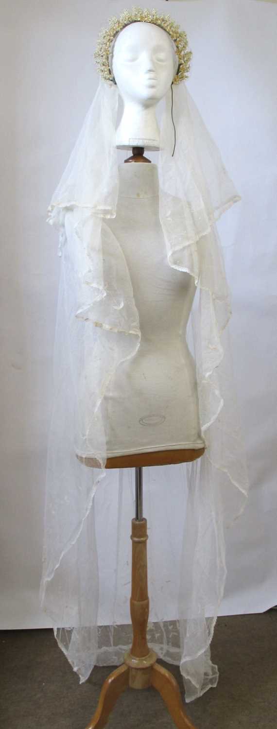 Lot 15 - A wedding veil, c.1920-30, with beaded floral...