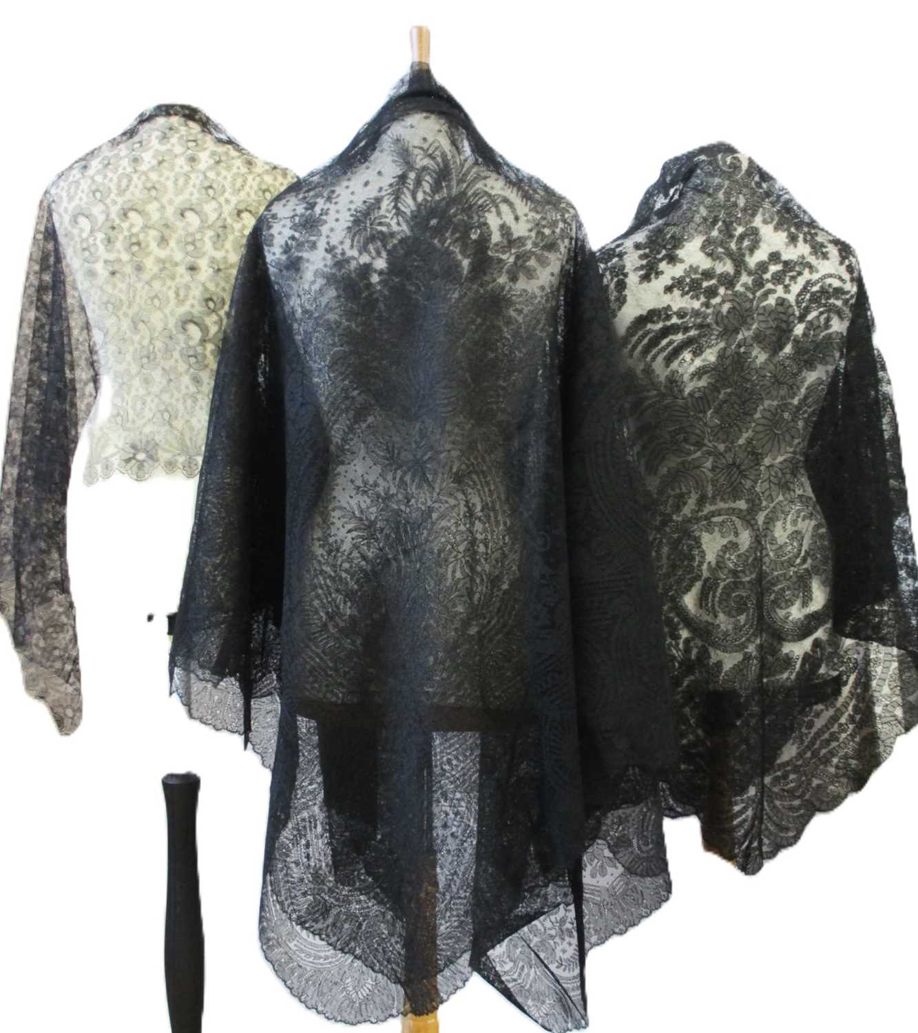 Lot 6 - Five black lace shawls, largest 190 x 190cm, (5)