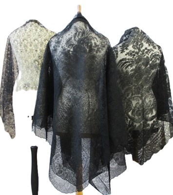 Lot 6 - Five black lace shawls, largest 190 x 190cm, (5)