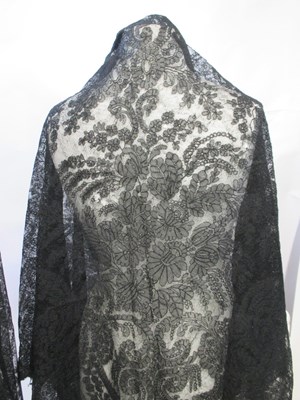 Lot 6 - Five black lace shawls, largest 190 x 190cm, (5)