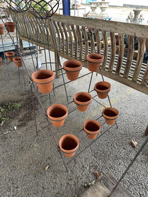 Lot 198 - Metal plant pot stand including nine...
