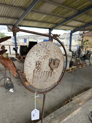Lot 209 - Decorative stake picturing a metal disc with...