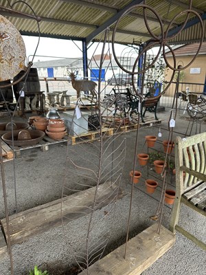 Lot 211 - A decorative metal garden Support, formed as a...