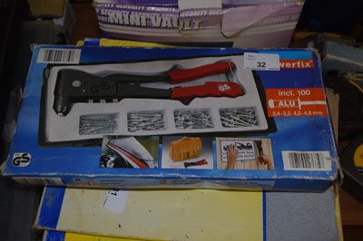 Lot 32 - A rivet gun with rivets