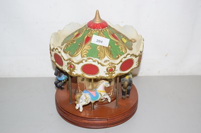 Lot 204 - A model fairground carousel