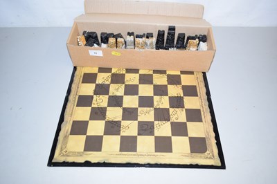 Lot 18 - A stone chess set and board