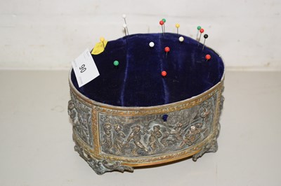 Lot 90 - A metal mounted pin cushion