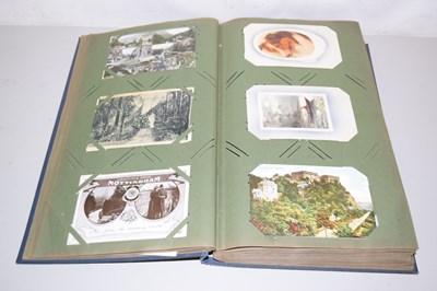 Lot 105 - An album of assorted postcards