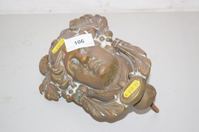 Lot 106 - A brass figural door knocker
