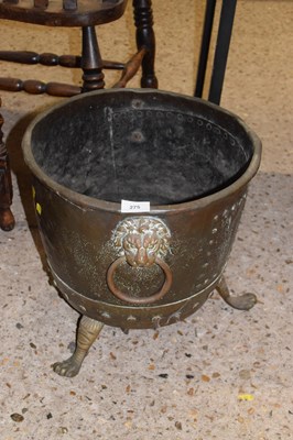 Lot 275 - A copper and brass planter on paw feet